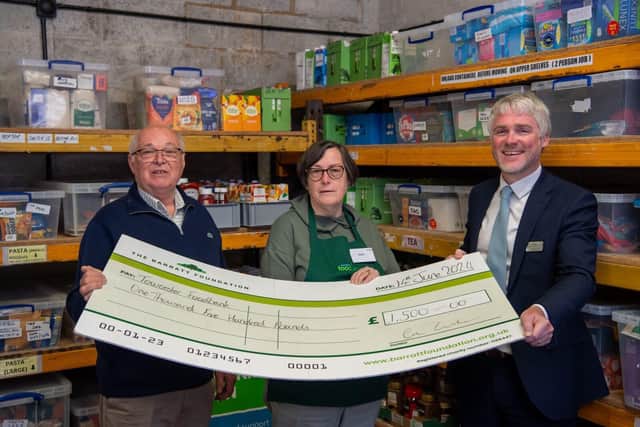 DWSM - SGB-48045 - Daniel of David Wilson Homes (R) with Cliff and Kate of Towcester Foodbank