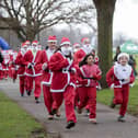 Hundreds of runners pulled on red suits for the festive run at the Racecourse in Northampton on Sunday December 10.