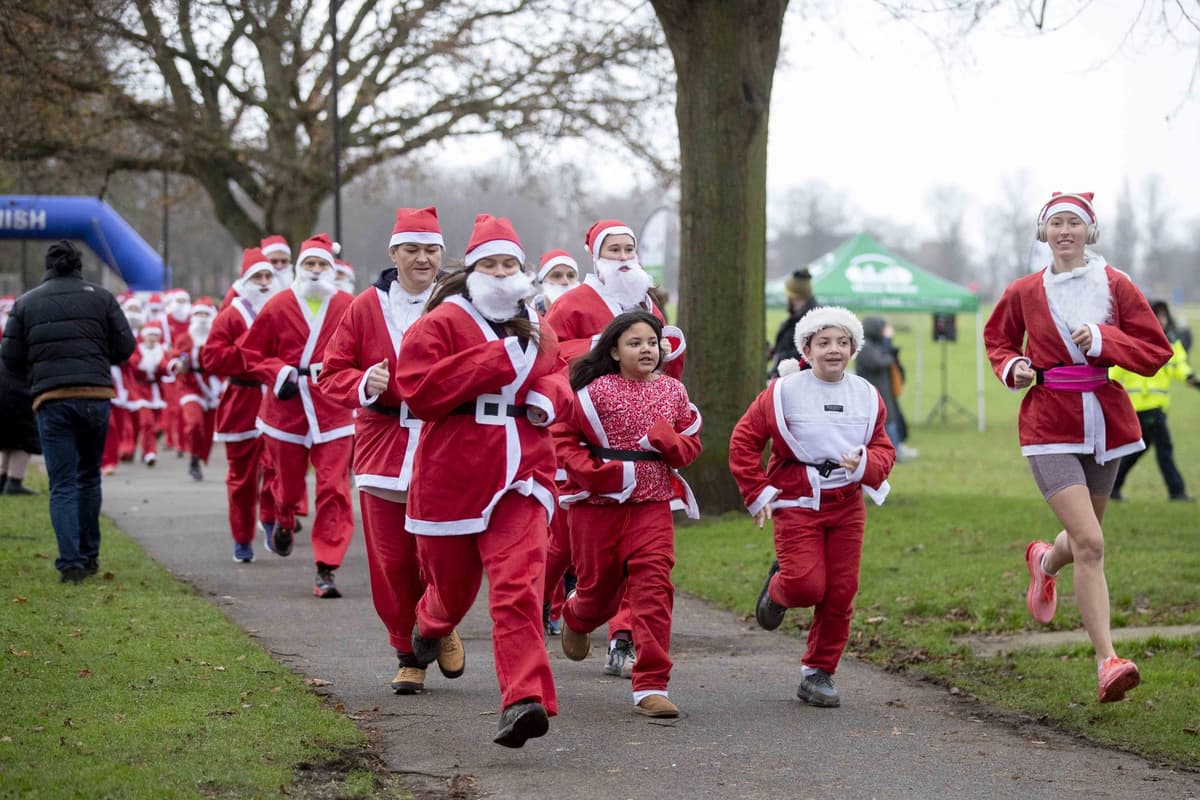 North Rocks Fun Run In pictures: Sea of red as hundreds of Santas take on annual fun run in ...