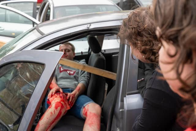 Young people from the GAINN Project looking on at the 'mock' RTC