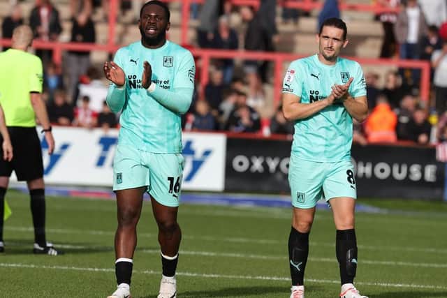 Tyreece Simpson and Ben Fox applaud the travelling fans as they leave the pitch at the end of the Sky Bet League One match between Exeter City and Northampton Town at St James Park on September 30, 2023 in Exeter, England. (Photo by Pete Norton/Getty Images)