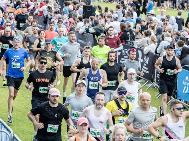 Hundreds of runners braved showers and wind to take on the race on Sunday (May 25), which started and finished at Sixfields stadium.