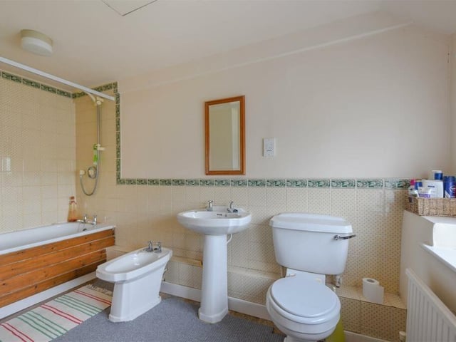 A large family bathroom has plenty of space for all of the required facilities