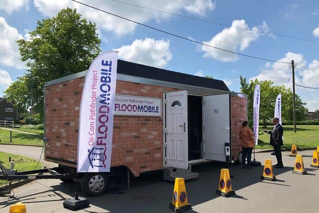 Flood resilience champion Mary Long-Dhonau OBE stands by the Floodmobile