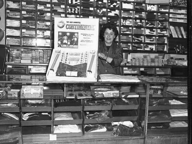 We think this may have been the same shop, with the assistant showing off the Subbuteo Continental game, which would probably be worth a fortune now.