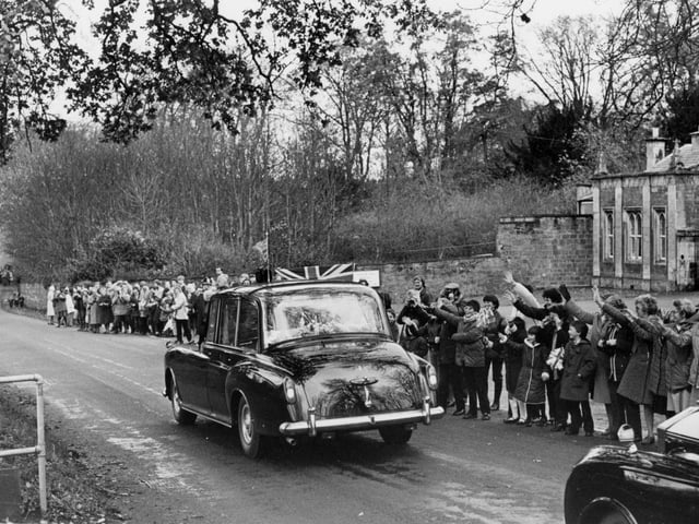 The Queen's car passes Rushton Hall and cheering crowds in 1982