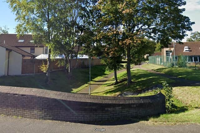 Police are hunting three teenagers who robbed a 13-year-old at knifepoint near this underpass in Ecton Brook