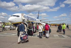 Paasengers board a RyanAir flight at East Midlands Airport