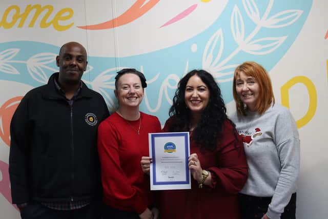 NPH Support and Welfare team representatives with the erosh accreditation certificate