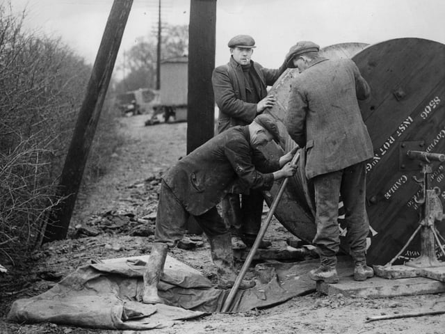 23rd February 1936: Post Office engineers in Northampton laying Britain's first television cable. (Photo by Arthur Tanner/Fox Photos/Getty Images)