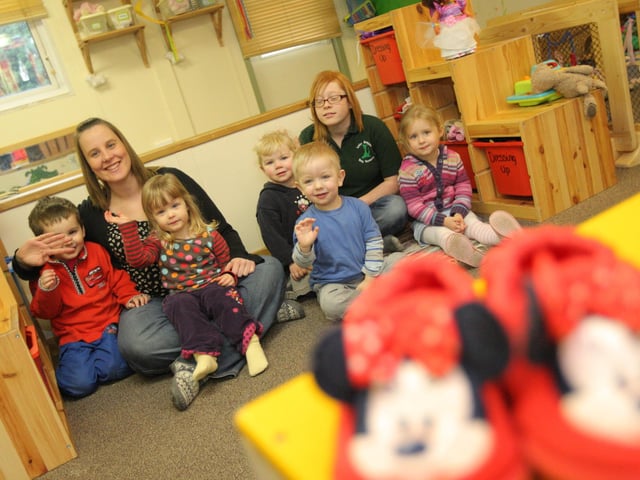 Little Dragons Day Nursery, Pattishall School, School Road, Pattishall. Pictured are nursery assistant Katie Ford (red hair) and manager Jo Morey (black top-brown hair) with children for feature on apprenticeships