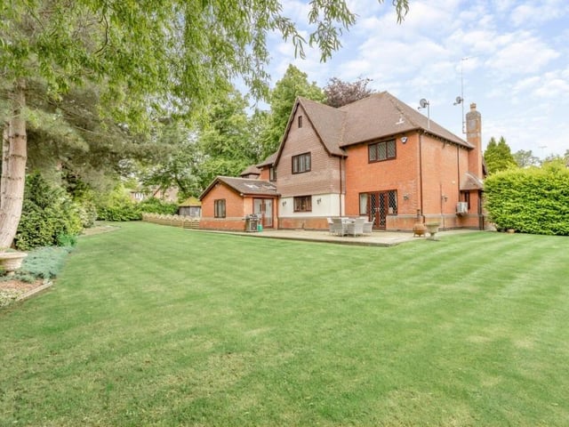 The property covers 0.48 acres and includes a vast garden at its rear