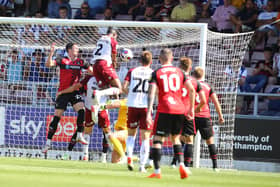 Tyler Magloire rises highest to head the Cobblers into a 1-0 lead against Hartlepool United at Sixfields (Picture: Pete Norton)