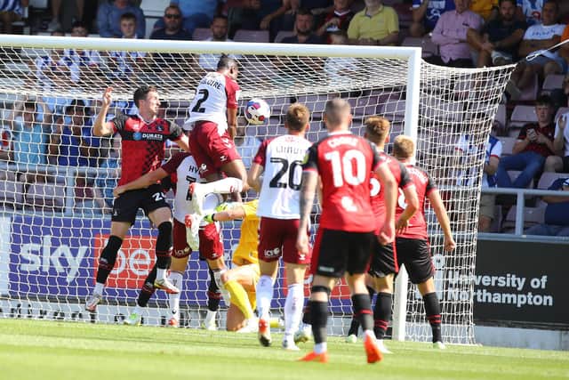 Tyler Magloire rises highest to head the Cobblers into a 1-0 lead against Hartlepool United at Sixfields (Picture: Pete Norton)