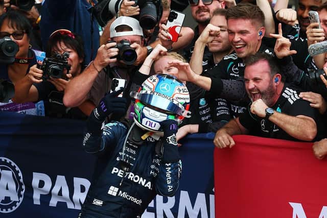 Race winner Kimi Antonelli celebrates with the Mercedes team members after his victory in Austin, Texas