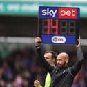 Fourth Official Darren Drysdale holds aloft the board to show 14 minutes added time in the second half  during the Sky Bet League One match between Northampton Town and Stevenage at Sixfields. (Photo by Pete Norton/Getty Images)