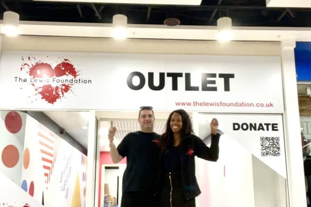 Lee and Lorraine Lewis outside The Lewis Foundation Outlet