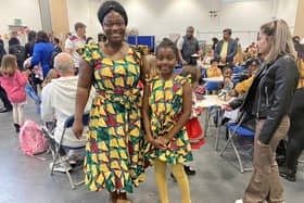 Mother Anita (left) and her daughter Aubrey (right), a year three pupil at Castle Academy, attended the international food event in their traditional dress from Ghana. Anita praised the school for celebrating the diversity of its students and their families.
