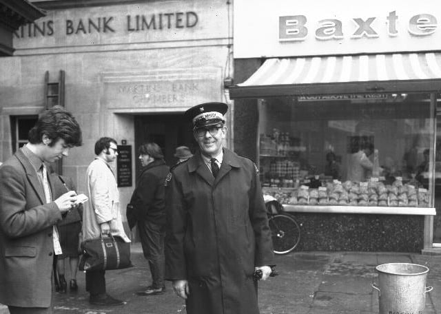 Chron reporter interviews traffic warden outside Martins Bank, possibly in Drapery, Northampton.