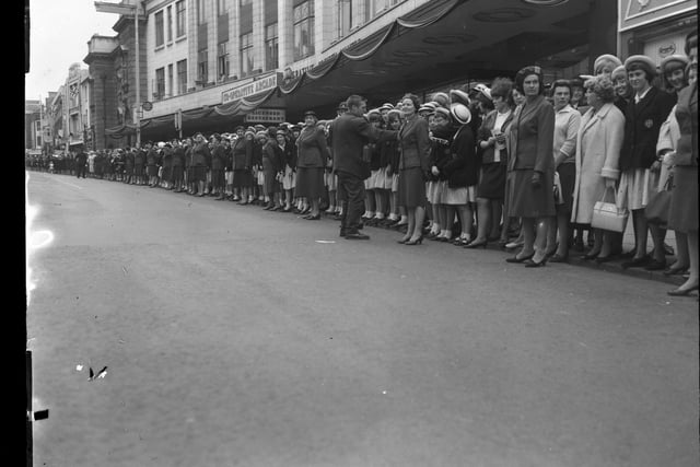 Abington Street, Northampton as crowds gather and wait to catch a glimpse of The Queen on July 9, 1965. Her Majesty had lunch at the Town Hall and visited Church's shoe factory before going to Althorp.
