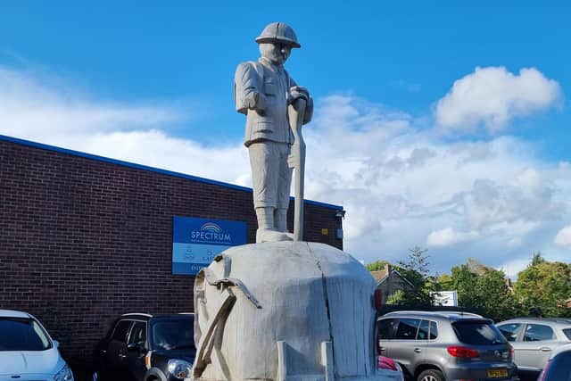 Concerns have been raised about why the wooden carving of the ‘Unknown Soldier’ in Duston is missing its right arm.