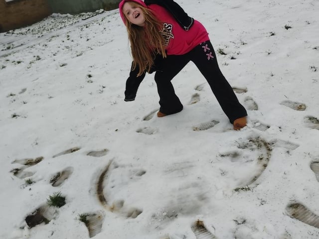 Poppy and her snow angel.