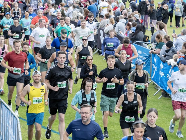 Hundreds of runners braved showers and wind to take on the race on Sunday (May 25), which started and finished at Sixfields stadium.