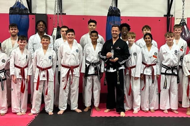 Proaction Chief Instructor Master Nicholson and Students accepting their award.