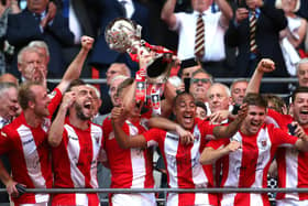Glenn Walker pictured in the thick of the celebrations when Brackley Town won the FA Trophy in 2018