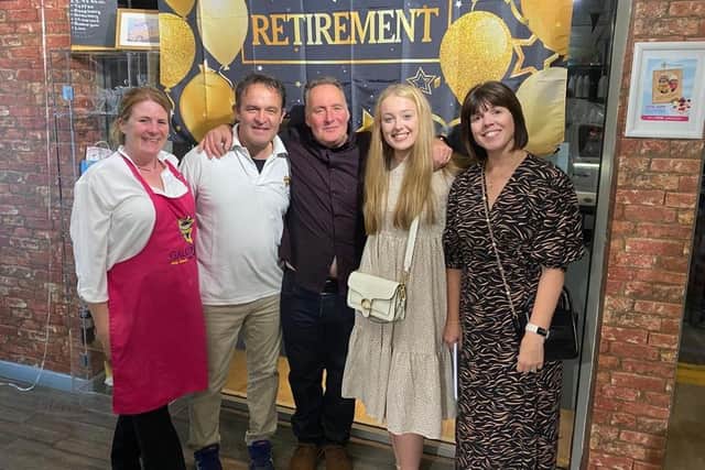 Peter (middle) alongside Aldo Gallone (left) and his family at his recent surprise retirement party