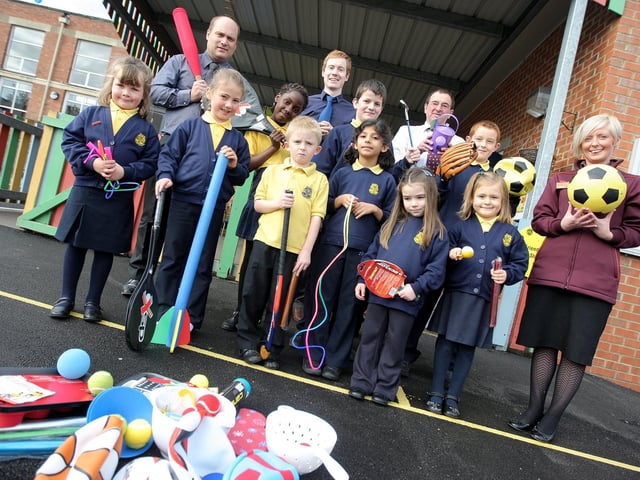Sainsbury's staff from the Grosvenor Centre store donating sports equipment to Delapre Primary School as part of their Active Kids campaign.  Pictured: Karl Cunningham, store manager and Donna Thomson, team leader with staff and pupils from Delapre Primary School.