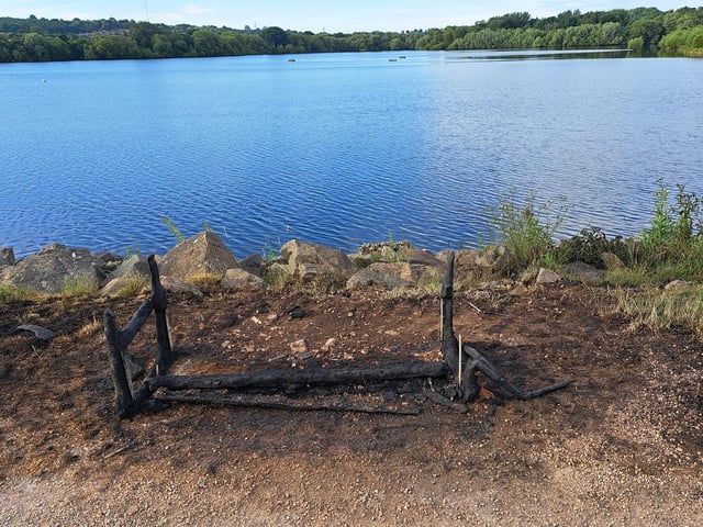 The memorial bench pictured after it was destroyed.