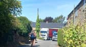 A lorry, ignoring 'NO HGV' signs, tries to pass through Chapel Lane, Farthinghoe on Friday