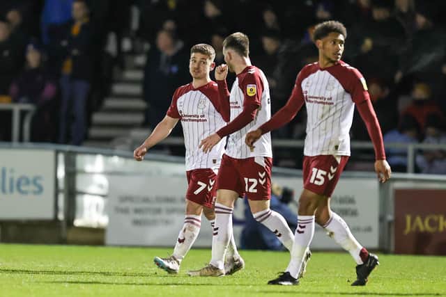 Sam Hoskins walks away after firing the Cobblers into the lead from the penalty spot (Picture: Pete Norton)