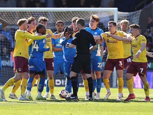 The Posh defender was dismissed for raising his hands to Cameron McGeehan's face during this scuffle