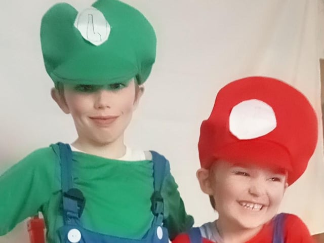 Logan, aged nine, as Lugi and Ronnie, aged five, as Mario.