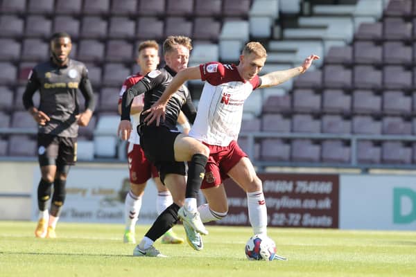 Mitch Pinnock in action for the Cobblers against Rochdale