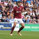 Captain Jon Guthrie on the ball during the Sky Bet League One match between Northampton Town and Peterborough United at Sixfields on August 19, 2023 in Northampton, England. (Photo by Pete Norton/Getty Images)