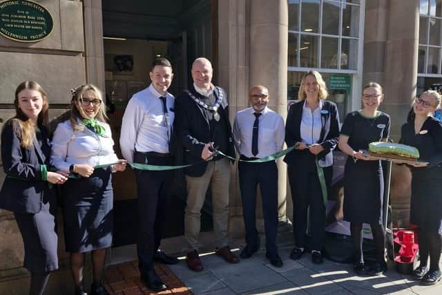 The Towcester team with the Mayor cutting the ribbon for the new store