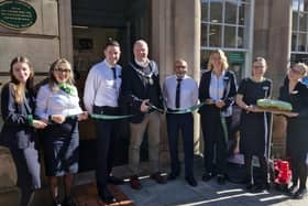 The Towcester team with the Mayor cutting the ribbon for the new store