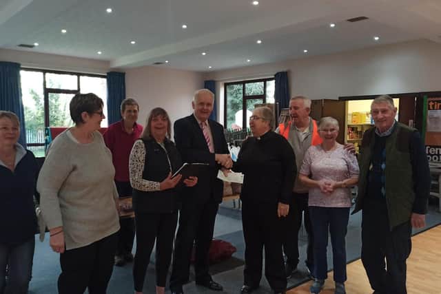 Cllr O’Connor presenting cheques to Revd Canon Jane Butler Team Rector for Church of England Kingsthorpe.