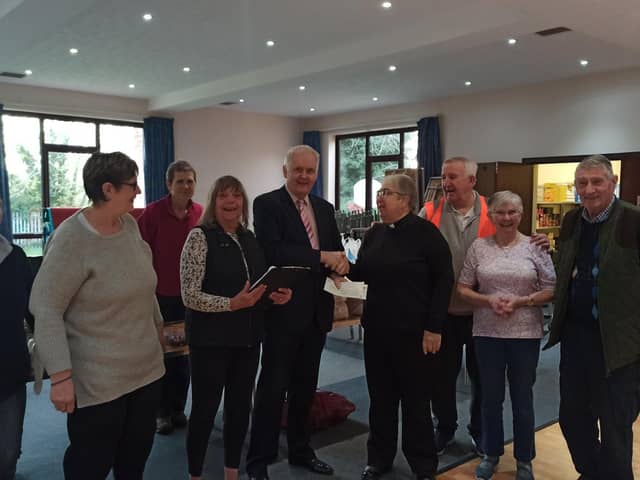 Cllr O’Connor presenting cheques to Revd Canon Jane Butler Team Rector for Church of England Kingsthorpe.