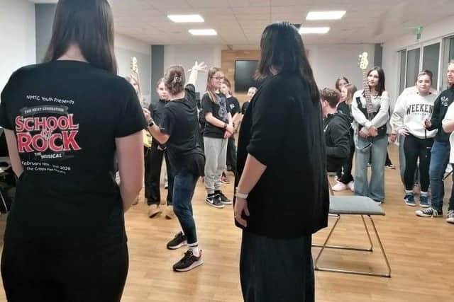 Cast from NMTC Youth School of Rock and director Katy Batchelor