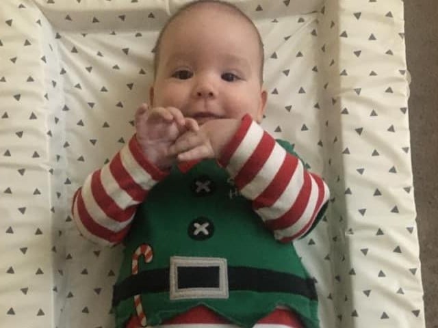 Elliot's, who is four months old, celebrating his first Christmas.
