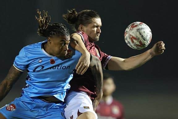 Cobblers midfielder Ben Fox tussles with Kettering's Isiah Noel-Williams (Picture: Pete Norton)