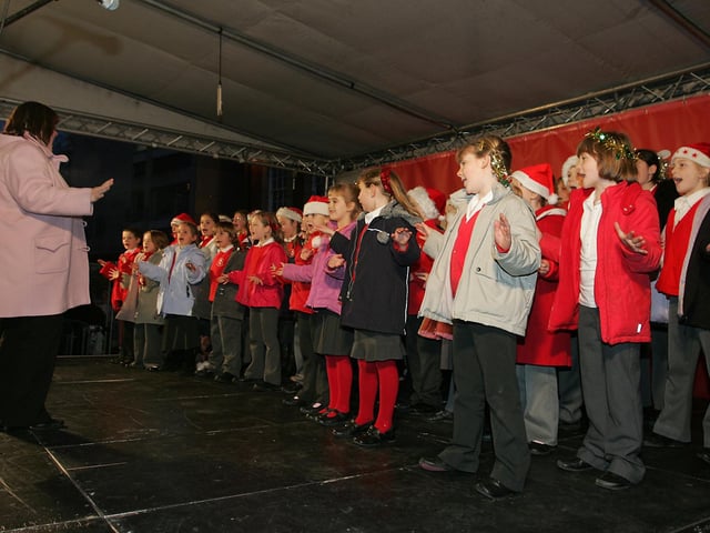 A children's choir takes to the stage in 2006.