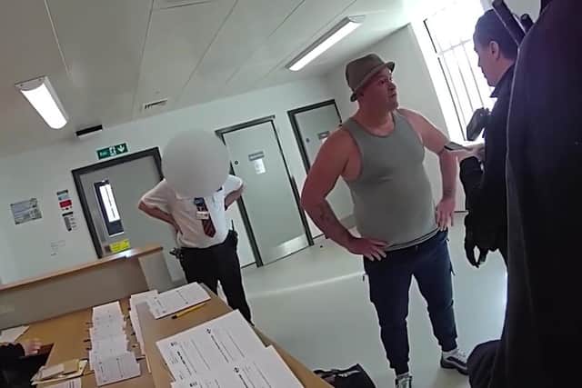 Video grab of the moment Amos Smith who stole almost £15,000 from pensioner was arrested - as he walked out of prison.