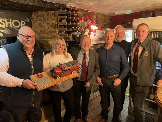 Richard Gordon and Sonya Harvey of Greedy Gordons receive the award presented by Geddington Volunteer Fire Brigade (GVFB) members Pete Faulkner, Graham Story, Graeme Atkins and Simon Clubb.