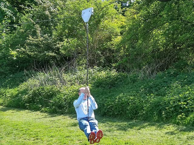 Chris Heaton-Harris testing out the new zip wire.
