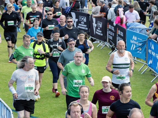 Hundreds of runners braved showers and wind to take on the race on Sunday (May 25), which started and finished at Sixfields stadium.